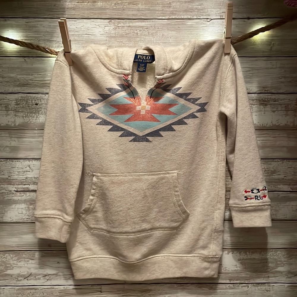 Cream hoodie with tribal print on front signature